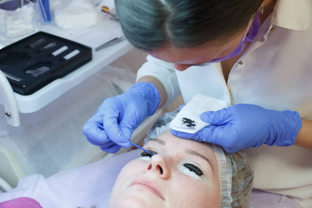 istock Woman on the procedure for eyelash extensions, eyelashes lamination 1140279560