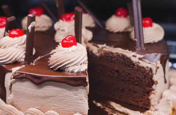 istock chocolate sponge cake decorated with creams and cherries 1140285036