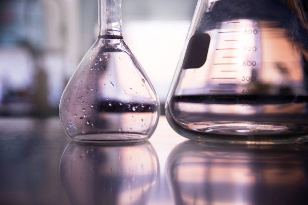 part of volumetric and conical glass flask on education chemistry science laboratory background