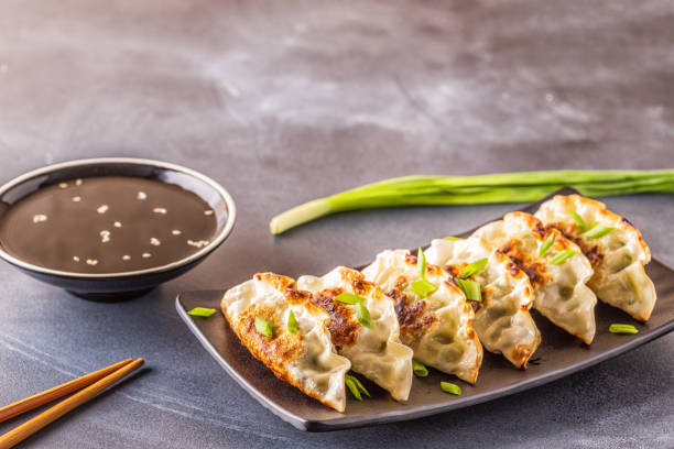 istock Gyoza or dumplings snack with soy sauce, selective focus 1140286777