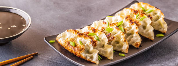 istock Gyoza or dumplings snack with soy sauce, selective focus 1140286800