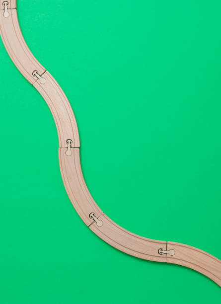 istock wooden rails on green background. Top view. 1140286813