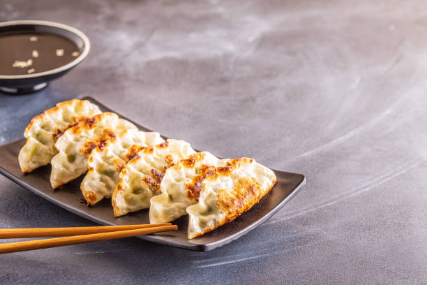 istock Gyoza or dumplings snack with soy sauce, selective focus 1140286818