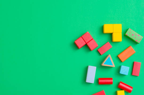 istock Kid toy top view isolated on green background, kid or child development concept 1140286843