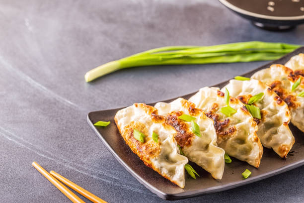 istock Gyoza or dumplings snack with soy sauce, selective focus 1140286845