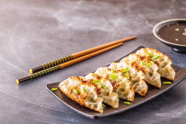 istock Gyoza or dumplings snack with soy sauce, selective focus 1140286872