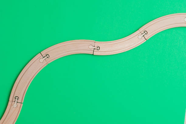 istock wooden rails on green background. Top view. 1140286877