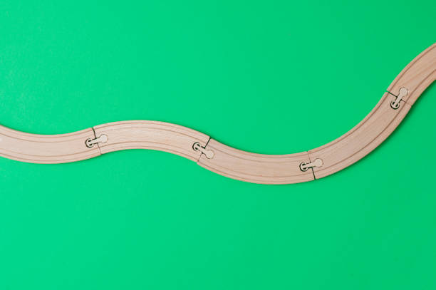 istock wooden rails on green background. Top view. 1140286898