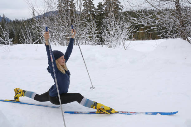 istock Cross country skier stretches on trail in forest 1140287149