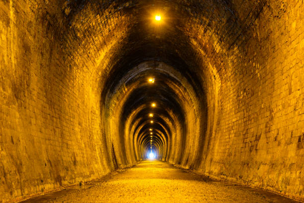 istock Old brick tunnel. A walkway used to be a railway before. 1140288744