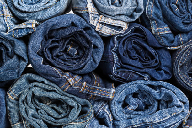 Blue jean background .Blue denim jeans texture. Jeans background. Blue torn denim jeans texture.classic nature tone jean.denim jeans texture background with frayed hole, black fabric grunge background