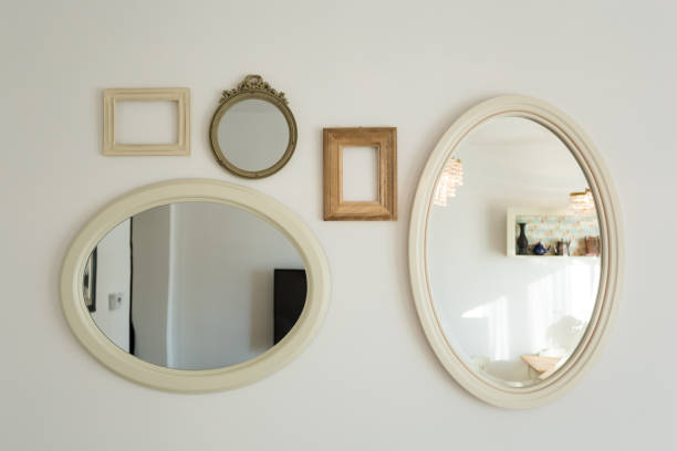 istock lots of empty picture frames hung on white wall 1140293686