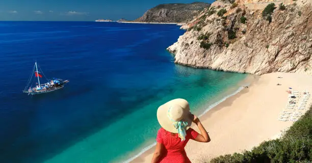 Woman looking at a beautiful view of Mediterranean sea.