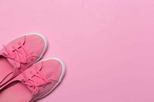 istock Pink shoes on a pastel background. Top view. Free space for text. 1140294811