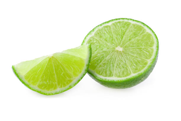 istock Half with slice of fresh green lime isolated on white background 1140295177
