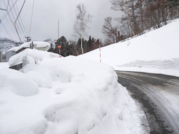 istock Driving by Snowy road with big deep snowdrifts 1140295445