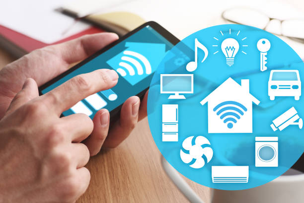 istock Smart home and IOT concept. Smartphone and many icons. 1140300286