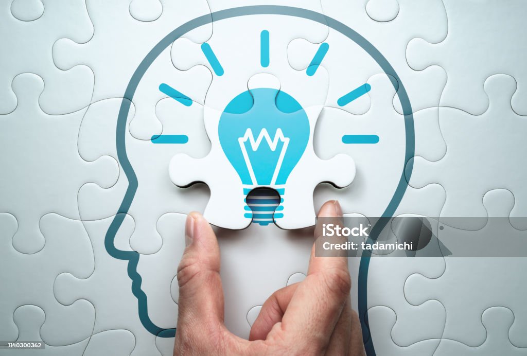 Getting knowledge and solving problem. Logical idea concept. Connecting last jigsaw puzzle piece. Contemplation Stock Photo