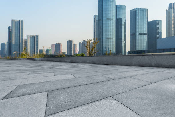 istock Empty pavement front of modern office buildings 1140301369