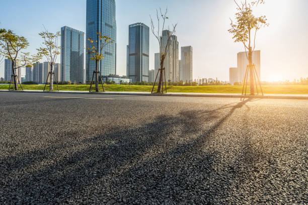 istock city empty traffic road under the sunbeam 1140301404
