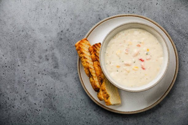 istock Chowder Crab Soup with shrimps and corn on concrete background copy space 1140301495