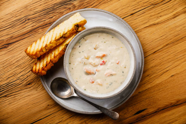 istock Boston Chowder Soup with Seafood on wooden background copy space 1140301502