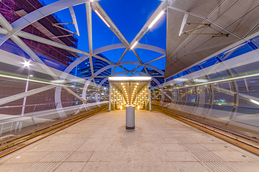 The Hague Beatrixkwartier tram station platform illumated at night waiting for passengers during the blue hour, The Hague, Netherlands\