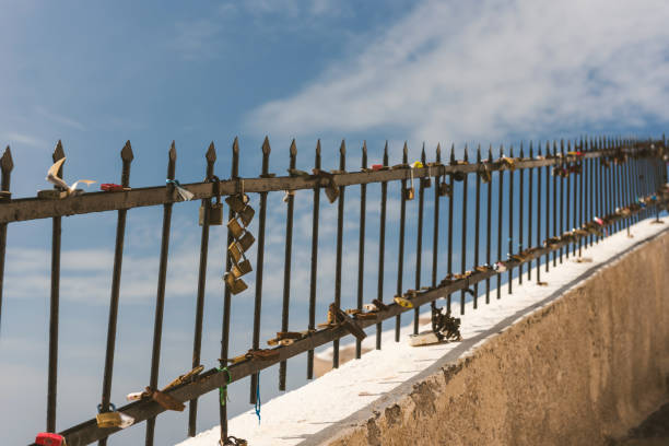 Padlocks in Thira, Santorini against cloudy sky