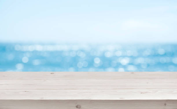 istock Blurred sea background with wood resort deck floor foreground 1140302808