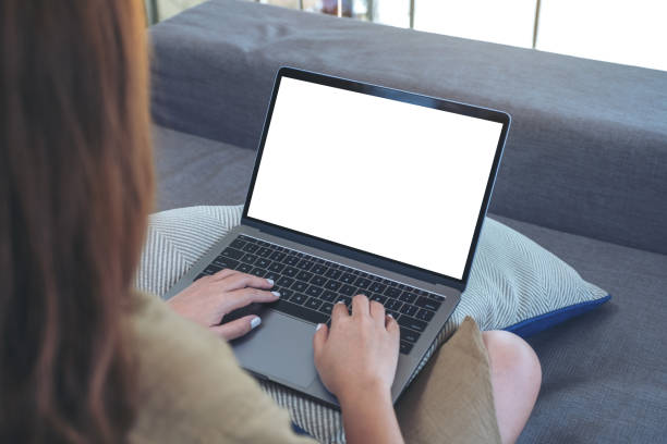 istock a woman using and typing on laptop keyboard with blank white screen while sitting in living room 1140303270