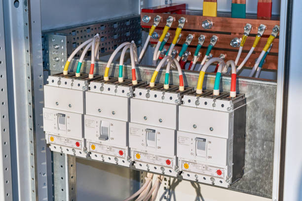 istock Four power circuit breakers are fixed in the electrical Cabinet in line. 1140303299