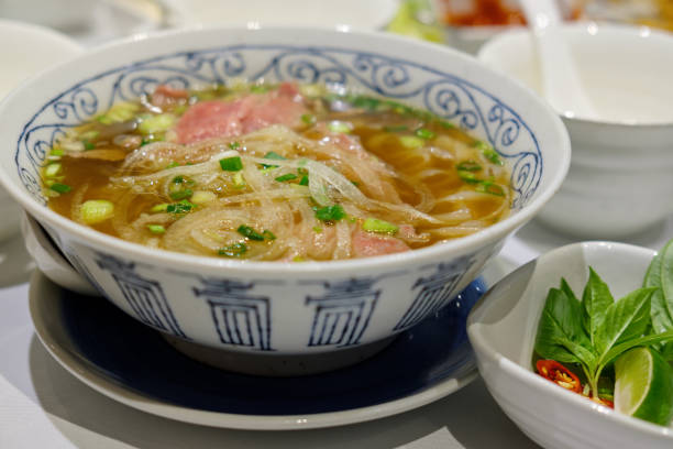 istock Rice pasta with sliced raw beef in veal (vietnamese pho Beef Noodle Soup) 1140304327