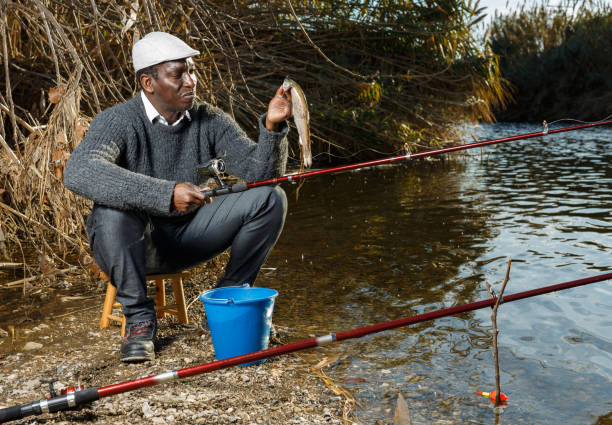 istock Friendly mature Afro fisherman 1140304638