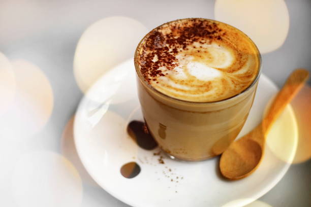 istock Hot latte coffee on the table with blurred bokeh background. 1140305537