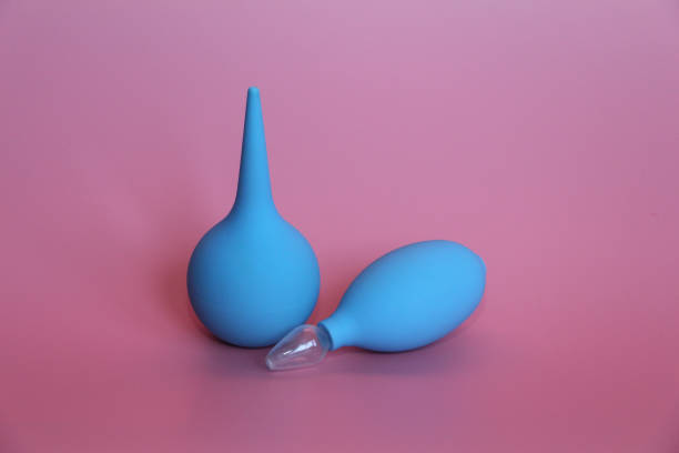 istock Blue enema with a soft tip. Blue nasal aspirator with glass tip. 1140305754