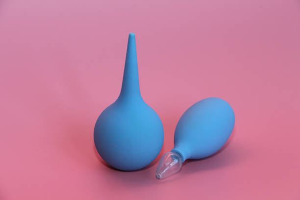 istock Blue enema with a soft tip. Blue nasal aspirator with glass tip. 1140305786