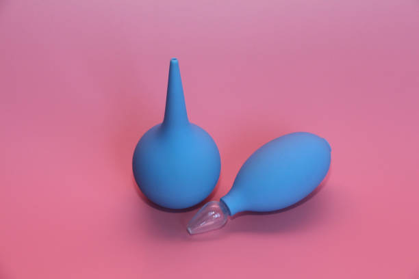 istock Blue enema with a soft tip. Blue nasal aspirator with glass tip. 1140305857