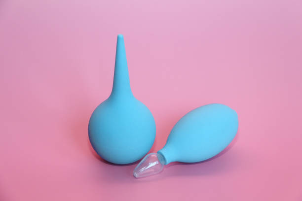 istock Blue enema with a soft tip. Blue nasal aspirator with glass tip. 1140305972