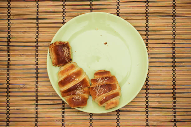 istock Croissants in green plate on the table 1140307951