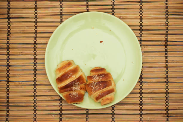 istock Croissants in green plate on the table 1140307975