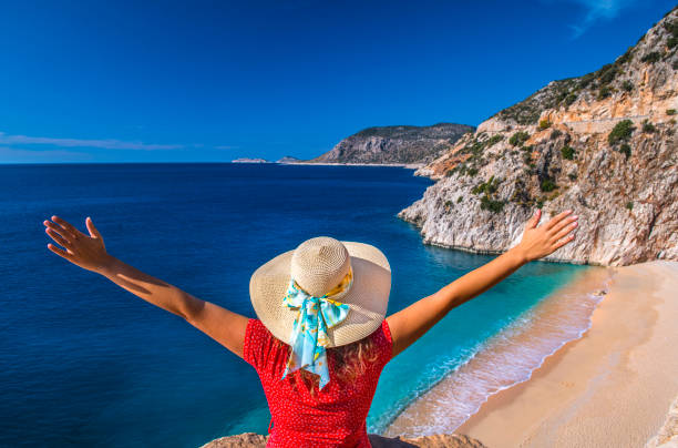 istock Happy woman at beach on summer 1140311498