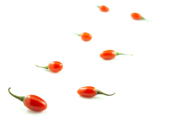 fresh goji berries isolated on white copy space closeup selective focus