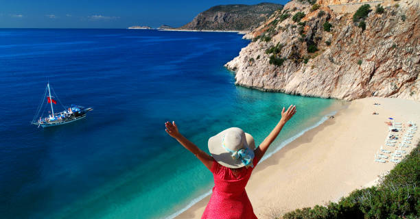 istock Happy woman at beach on summer 1140313214