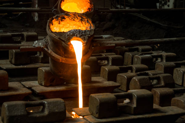 istock metal casting process with red high temperature fire in metal part factory 1140317446
