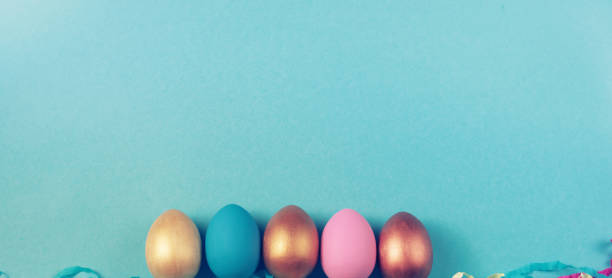 istock Banner Easter set of colored eggs on bright blue background Easter holiday decorations 1140319619