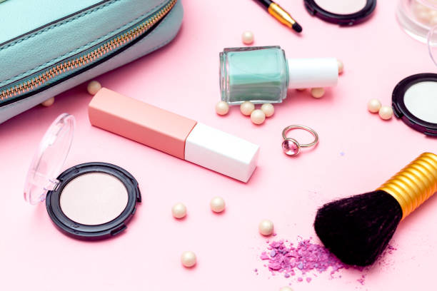istock Feminine accessories and make up on pink background. 1140321184