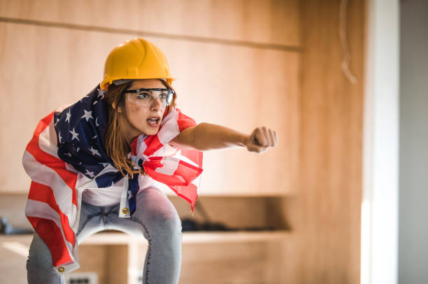 Feminism concept. Funny portrait of strong woman shoving her biceps