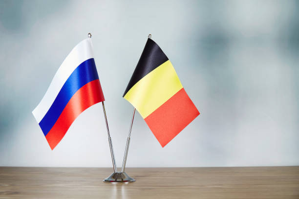 istock Russian and Belgian flag standing on the table 1140325283