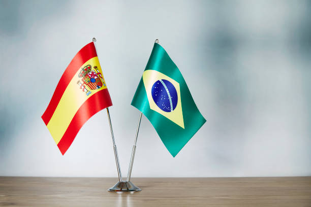 istock Spanish and Brazilian flag standing on the table 1140325367