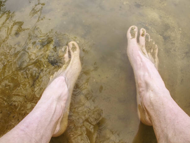 istock Washing mud from body after extreme race run. Muddy runner 1140326188